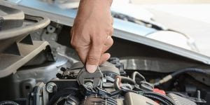 a mechanic repairing a battery